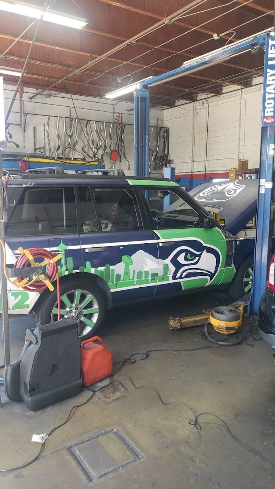 A vehicle up in one of the Petro service bays